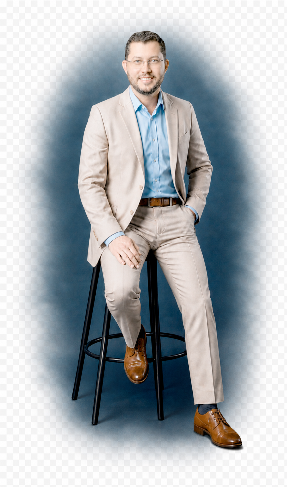 Portrait of Jorge Posada seated against a dark blue studio backdrop
